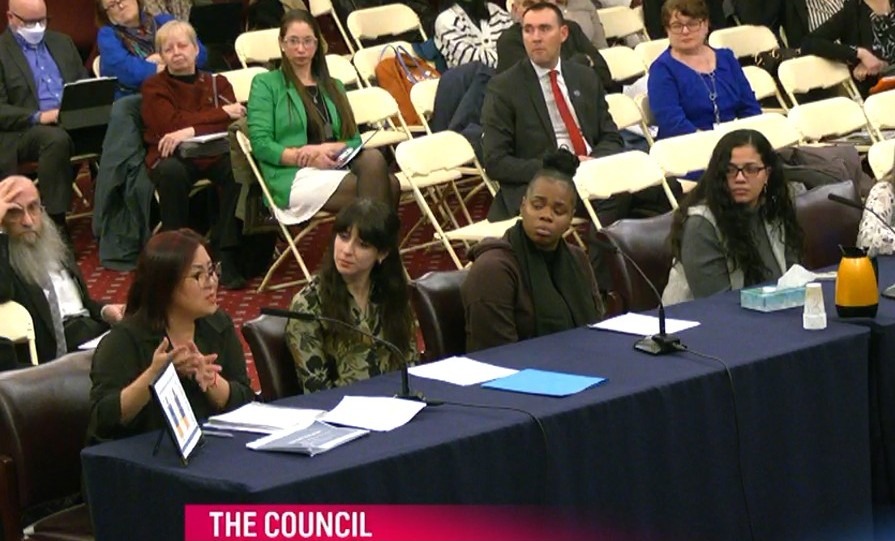 Jenn Choi and another group of women presenting some ideas at the meeting